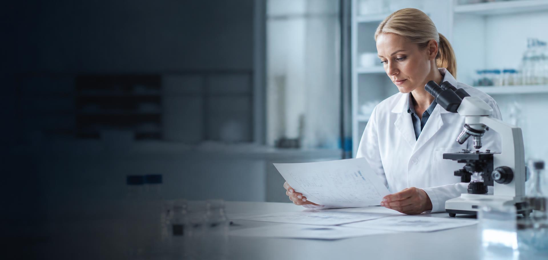 A researcher reading clinical literature